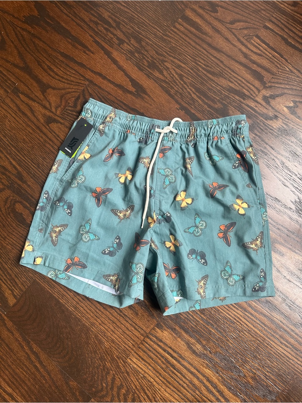RSQ swim shorts feature an all-over butterfly pattern